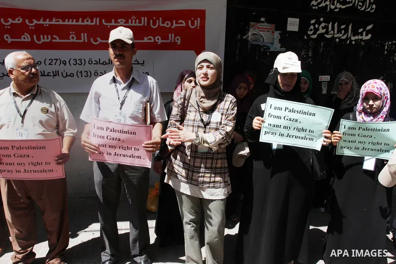 palestinians take part a protest to demand their right to pray in Jerusalem, in Gaza city, on June 20, 2013. Photo by Mohammed Asad