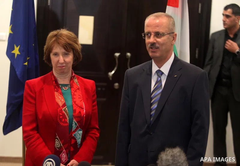 (FILE) A file picture dated 19 June 2013 shows Palestinian Prime Meinister Rami Hamdallah meets with European Union foreign policy chief Catherine Ashton during their joint news conference after their meeting in the West...