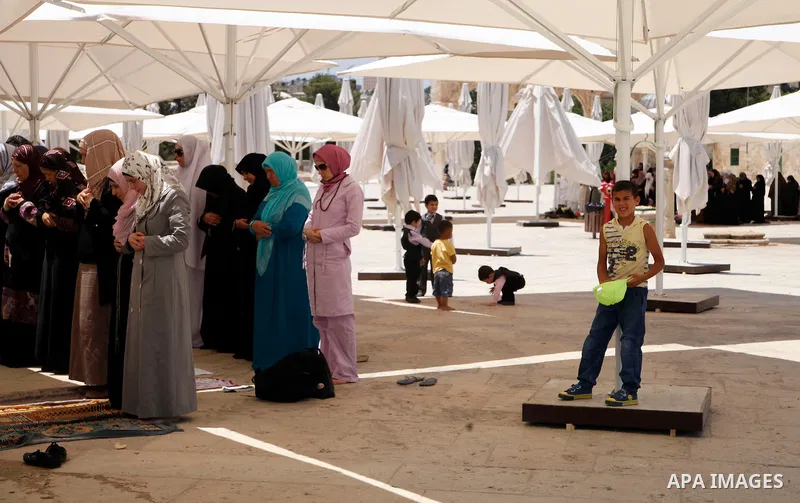 Palestinian women worshipers attend Friday prayers at al-Aqsa mosque compound, Islam's third holiest site, in Jerusalem's old city on June 21, 2013. Photo by Saeed Qaq