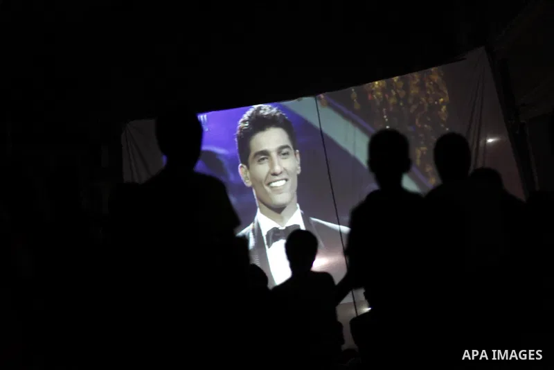Palestinians celebrate after Palestinian singer Mohammed Assaf won a regional TV singing contest, in front of Assaf's home, in Khan Younis in southern Gaza Strip, June 22, 2013. Palestinians relished a rare moment of pri...