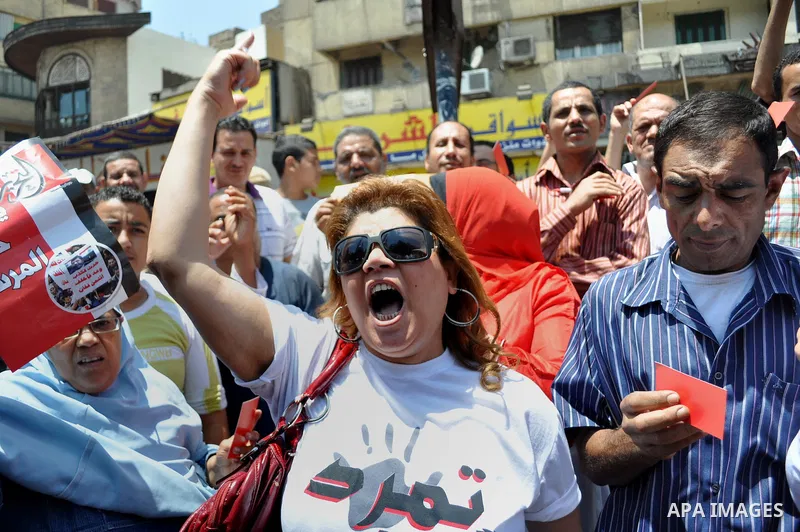Egyptian protesters shout anti-President Mohammed Morsi slogans during a protest in Tahrir Square, the focal point of Egyptian uprising, in Cairo, Egypt, Friday, June 28, 2013. Elsewhere, thousands of supporters of Egypt...