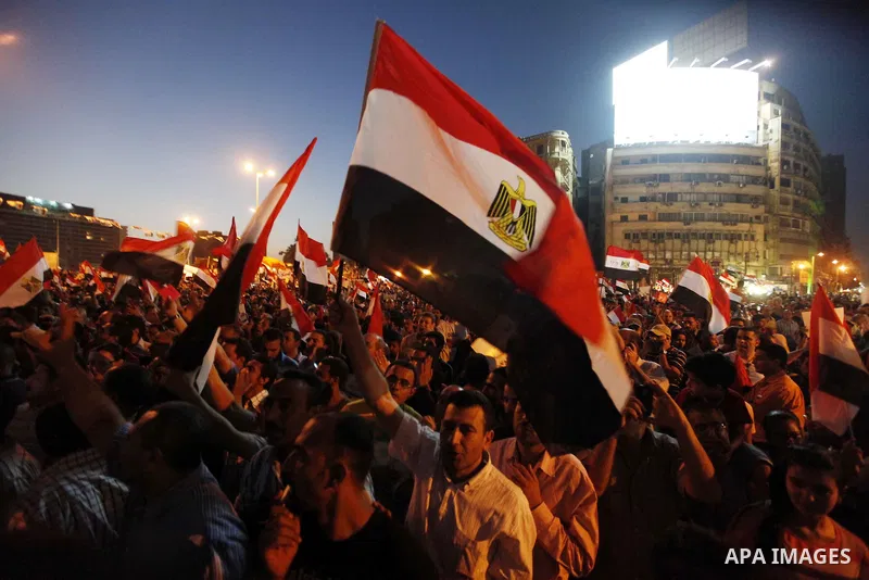 Egyptian protesters gather at Tahrir Square, the focal point of Egyptian uprising, during a protest against President Mohammed Morsi, in Cairo, Egypt, Friday, June 28, 2013. Elsewhere, thousands of supporters of Egypt's...