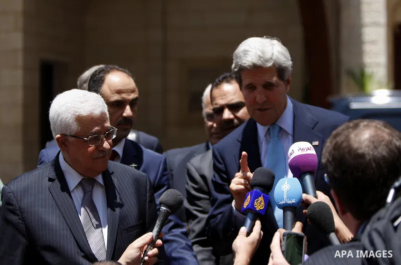 Palestinian President Mahmoud Abbas meets with U.S. Secretary of State John Kerry in the West Bank town of Ramallah, on Sunday, June 30, 2013. Kerry, engaged in breakneck shuttle diplomacy to coax Israel and the Palestin...