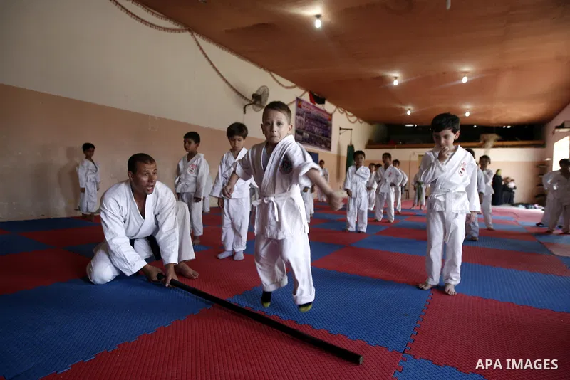 Palestinian boys take part in a karate class, which aims at teaching self-defense techniques during the summer holidays, at sport club in Gaza City on June 29, 2013. Photo by Emad Nassar