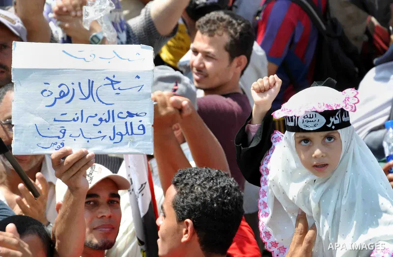 Supporters of Egyptian President Mohamed Mursi take part in a protest around the Raba El-Adwyia mosque square in Nasr City, a suburb of Cairo June 30, 2013. Mass demonstrations across Egypt on Sunday may determine its fu...