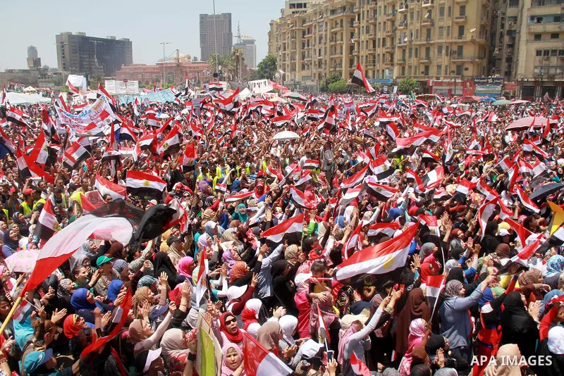 Protesters opposing Egyptian President Mohamed Mursi holds a sign during a protest at Tahrir square in Cairo June 30, 2013. Mass demonstrations across Egypt on Sunday may determine its future, two and half years after pe...