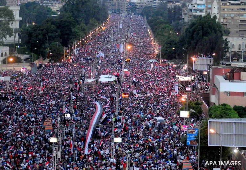A general view of Egyptians opposing President Morsi taking part in a protest demanding him to leave office, in front of the presidential palace in Cairo, Egypt, 30 June 2013. Tens of thousands of Egyptians took to the s...