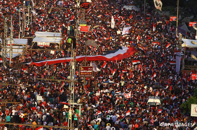 A general view of Egyptians opposing President Morsi taking part in a protest demanding him to leave office, in front of the presidential palace in Cairo, Egypt, 30 June 2013. Tens of thousands of Egyptians took to the s...