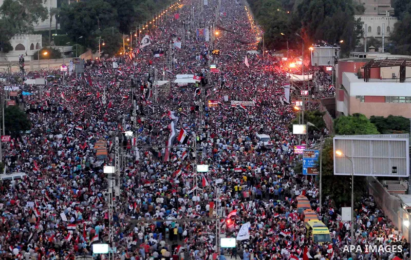 A general view of Egyptians opposing President Morsi taking part in a protest demanding him to leave office, in front of the presidential palace in Cairo, Egypt, 30 June 2013. Tens of thousands of Egyptians took to the s...