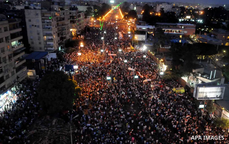 A general view of Egyptians opposing President Morsi taking part in a protest demanding him to leave office, in front of the presidential palace in Cairo, Egypt, 30 June 2013. Tens of thousands of Egyptians took to the s...