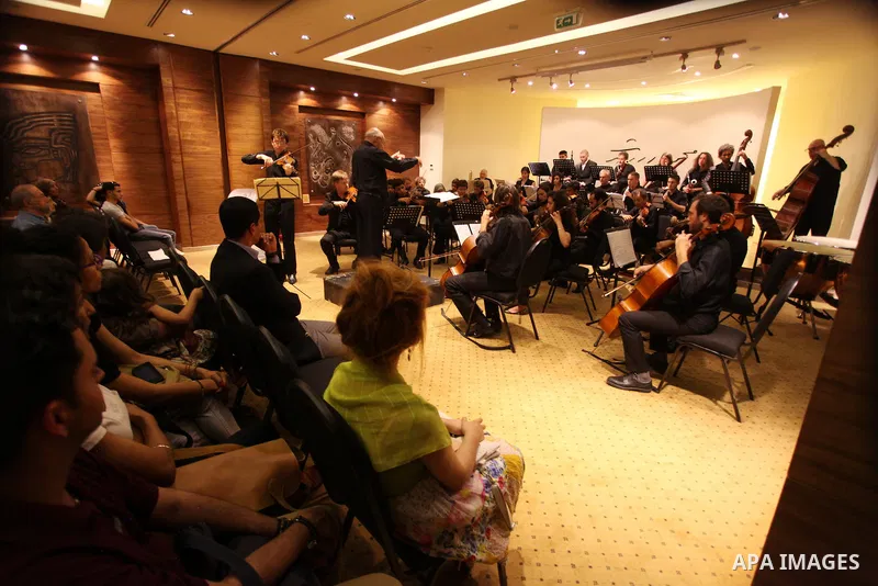 Palestinian artists of Ramallah Orchestra perform during a musical evening at Mahmoud Darwish museum, in the West Bank city of Ramallah June 30, 2013. Photo by Issam Rimawi