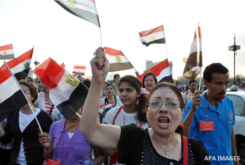Egyptian opponents take part in a protest demanding that Egyptian President Mohamed Mursi resign at Tahrir Square in Cairo July 1, 2013. Egypt's military on Monday issued a 48-hour ultimatum to the Islamist president and...