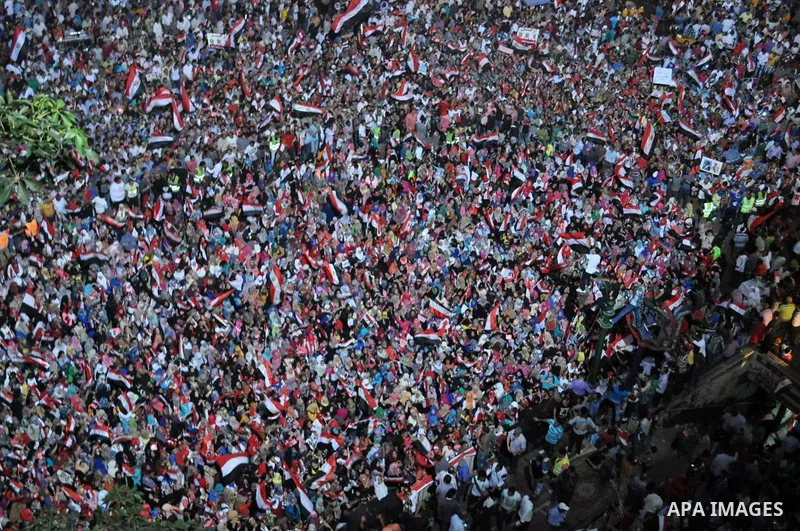 Fireworks light the sky as opponents of Egypt's Islamist President Mohammed Morsi protest in Tahrir square, in Cairo, Egypt, Tuesday, July 2, 2013. With the clock ticking, Egypt's besieged president said Tuesday that he...