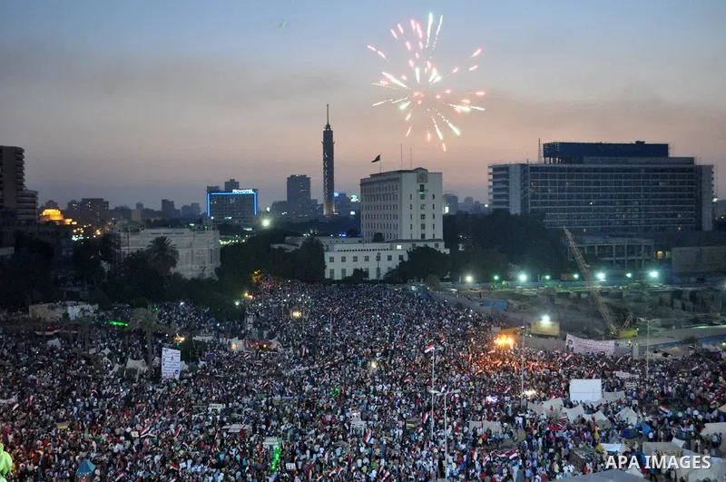 Fireworks light the sky as opponents of Egypt's Islamist President Mohammed Morsi protest in Tahrir square, in Cairo, Egypt, Tuesday, July 2, 2013. With the clock ticking, Egypt's besieged president said Tuesday that he...