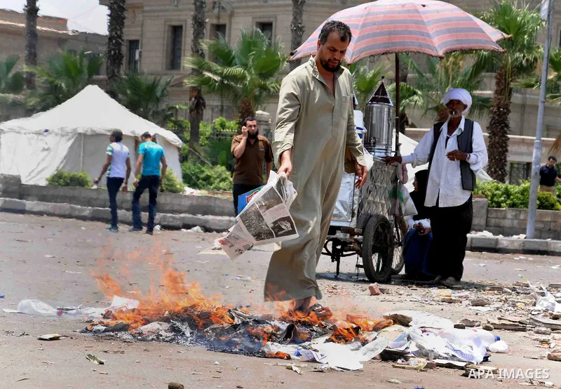 Supporters of Egyptian President Mohamed Mursi shout slogans during a protest to show support to him in front of Cairo University in Cairo July 3, 2013. At least 16 people were killed on Wednesday and 200 wounded when gu...