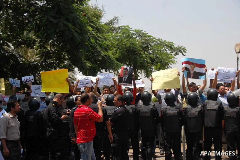 Supporters of ousted President Mohamed Morsi gather outside the Supreme Constitutional Court where Adli Mansour, the chief of Egypt's highest court, was sworn in as Egypt's interim president, in Cairo, Egypt, 04 July 201...