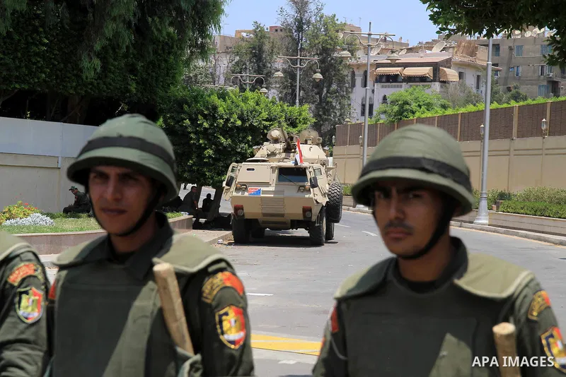Egyptian army armored vehicles and soldiers stationed are seen near the presidential palace, one day after the ousting of President Mohamed Morsi, in Cairo, Egypt, 04 July 2013. Adli Mansour, the chief of Egypt's highest...