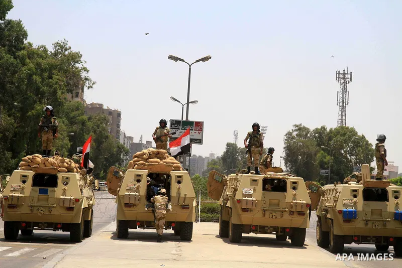 Egyptian army armored vehicles and soldiers stationed are seen near the presidential palace, one day after the ousting of President Mohamed Morsi, in Cairo, Egypt, 04 July 2013. Adli Mansour, the chief of Egypt's highest...