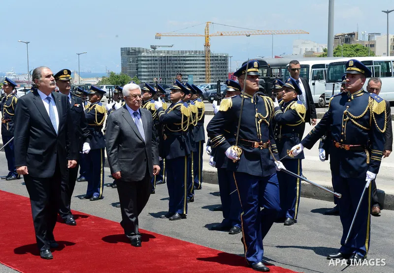 Palestinian president Mahmud Abbas reviews the guard of honour as he arrives in downtown Beirut to place a wreath on the Martyrs Statue on July 4, 2013. Abbas flew to Lebanon via Jordan, and is expected to offer the Leba...