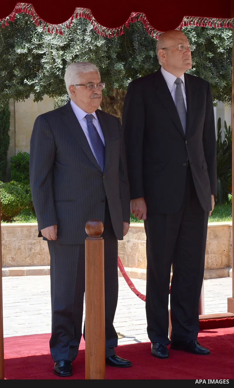 Lebanese Prime Minister Najib Mikati and Palestinian President Mahmoud Abbas stand for the national anthem at the Government palace in Beirut, Lebanon, 04 July 2013. Abbas arrived in Beirut on 03 July for a three-day off...