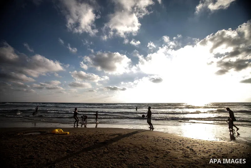 Tourists enjoy playing on the Mediterranean Sea in the Al-Naqoura area, southern Lebanon, near the Lebanese Israeli border, 05 July 2013. Al-Naqoura is a geologic formation, located on the coast of the Mediterranean Sea,...