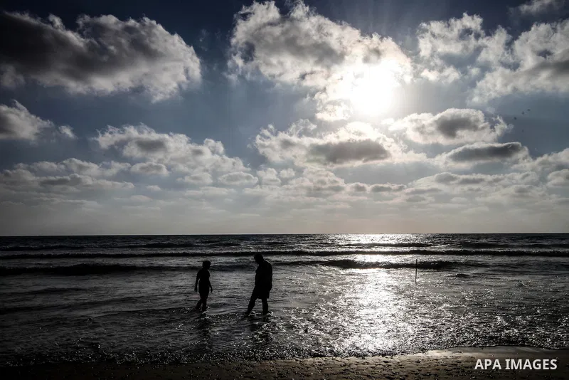 Tourists enjoy playing on the Mediterranean Sea in the Al-Naqoura area, southern Lebanon, near the Lebanese Israeli border, 05 July 2013. Al-Naqoura is a geologic formation, located on the coast of the Mediterranean Sea,...