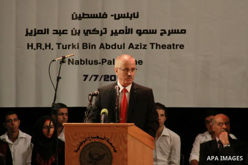 Palestinian Prime Minister Rami Hamdallah speaks during the visit of IFA President Joseph S. Blatter to the Al Najah University in the West Bank town city of Nablus , 7 July 2013, Blatter is visiting several cites in the...