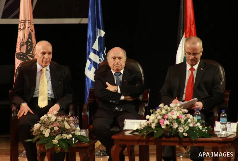 FIFA President Joseph S. Blatter (centre) visits the Al Najah University in the West Bank town city of Nablus , 7 July 2013, Blatter is visiting several cites in the West Bank during his second trip to the Palestinian te...