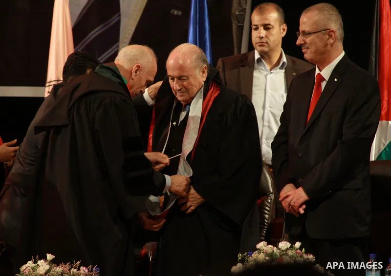 FIFA President Joseph S. Blatter (centre left) is honored by Palestinian Prime Minister Rami Hamdallah (second from right) after he was presented with an honorary doctorate of the Al Najah University during his visit in...