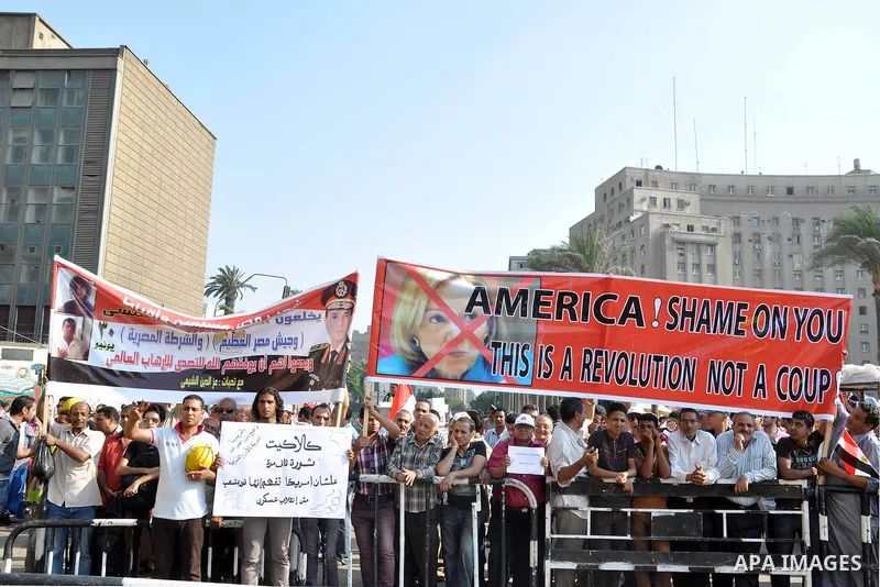 Egyptian protesters take part in a rally against US President Barack Obama in Cairo's Tahrir Square, on July 7, 2013. Opponents of Egypt's deposed Islamist president Mohamed Morsi packed Tahrir Square in their tens of th...