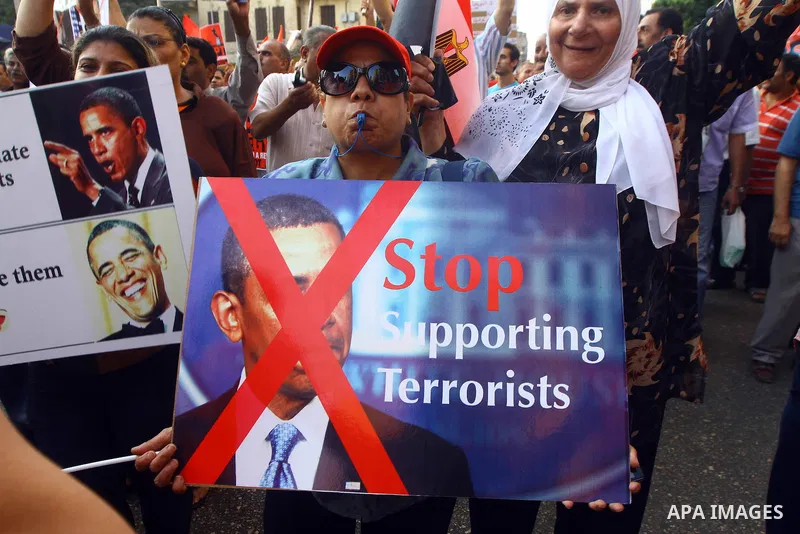 Egyptian protesters take part in a rally against US President Barack Obama in Cairo's Tahrir Square, on July 7, 2013. Opponents of Egypt's deposed Islamist president Mohamed Morsi packed Tahrir Square in their tens of th...