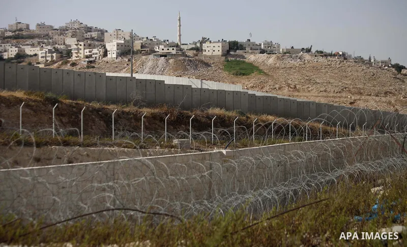 A picture shows a side of the Israeli separation wall arround Jerusalem on July 9, 2013. The Israeli Coordinator of Government Activities in the Territories (COGAT) announced in a press statement that Palestinian men and...