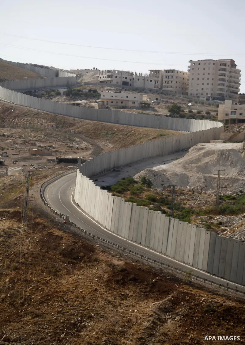 A picture shows a side of the Israeli separation wall arround Jerusalem on July 9, 2013. The Israeli Coordinator of Government Activities in the Territories (COGAT) announced in a press statement that Palestinian men and...