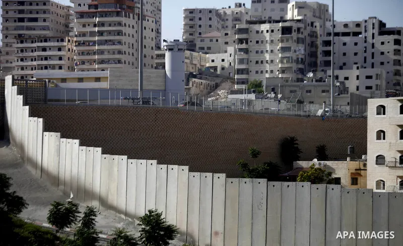 A picture shows a side of the Israeli separation wall arround Jerusalem on July 9, 2013. The Israeli Coordinator of Government Activities in the Territories (COGAT) announced in a press statement that Palestinian men and...