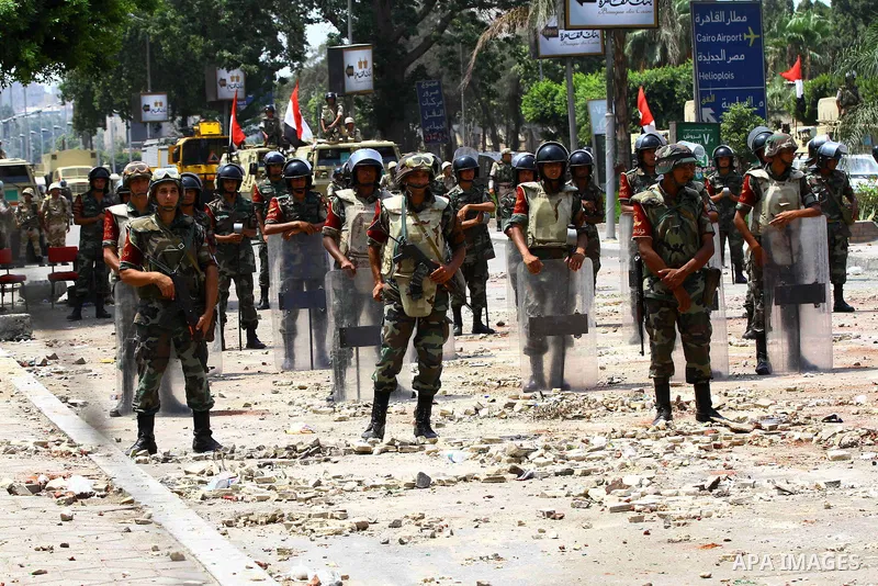 Egyptian Republican guards take position in front of their headquarter in Cairo on July 9, 2013. Egypt's armed forces warned in a statement against any attempt to disrupt the country's "difficult and complex" transition....