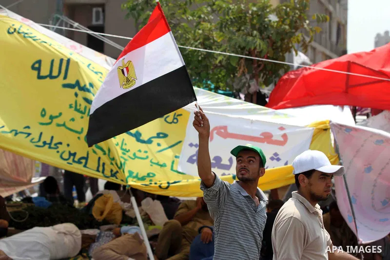 Egyptian supporters of deposed president Mohamed Morsi take part in a rally in support of the former Islamist leader outside Cairo's Rabaa al-Adawiya mosque on July 9, 2013. Egypt's interim leader vowed fresh elections b...