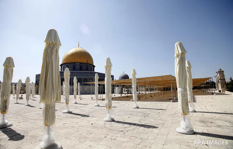 Parasols are set up ahead of the holy month of Ramadan at the al-Aqsa mosque compound in the old city of Jerusalem during the Muslim fasting month of Ramadan on July 10, 2013. During Ramadan, one of the five main religio...