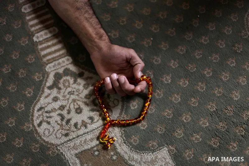 A Palestinian man takes a nap at al-Omari mosque on the first day of the Muslim fasting month of Ramadan on July 10, 2013 in Gaza City. During Ramadan, one of the five main religious obligations under Islam, Muslims are...