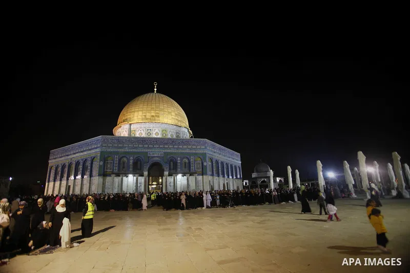 Palestinian Muslims perfom praying Taraweeh in al Aqsa mosque in the old city of Jerusalem after breaking the fast on the First day of the Moslem holy month of Ramadan on July 10, 2013. Photo by Saeed Qaq