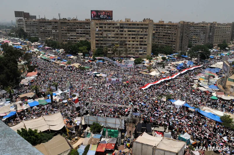 Supporters of ousted Egyptian President Mohamed Morsi take part in a protest outside Rabaa al-Adawiya mosque, after Friday prayers in Cairo, Egypt, 12 July 2013. Backers and opponents of Morsi were to hold rival rallies...