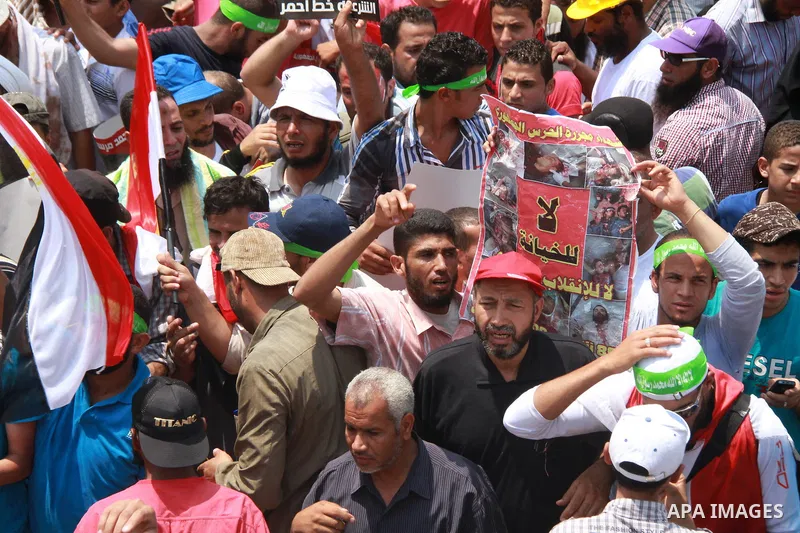 Supporters of ousted Egyptian President Mohamed Morsi take part in a protest outside Rabaa al-Adawiya mosque, after Friday prayers in Cairo, Egypt, 12 July 2013. Backers and opponents of Morsi were to hold rival rallies...