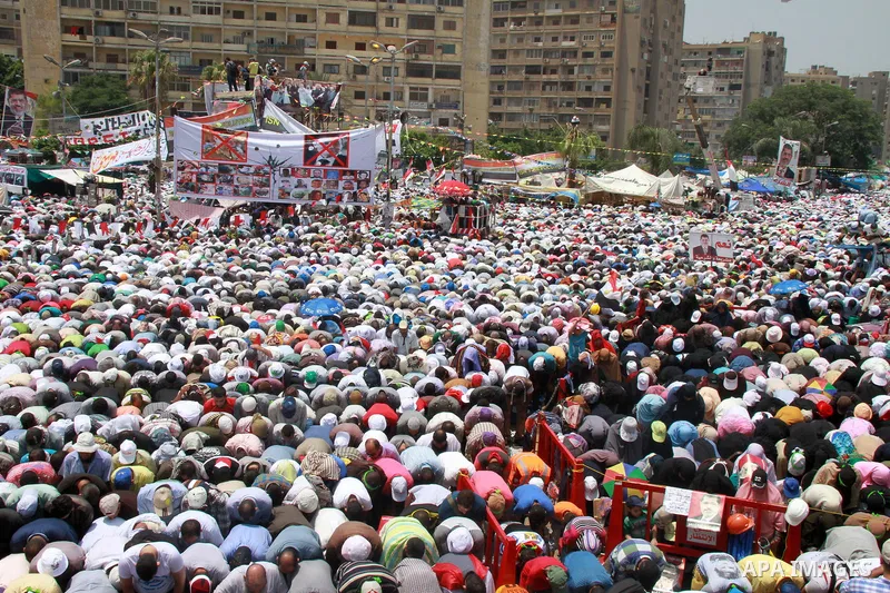 Supporters of ousted Egyptian President Mohamed Morsi perform Friday prayer during a protest outside Rabaa al-Adawiya mosque, after Friday prayers in Cairo, Egypt, 12 July 2013. Backers and opponents of Morsi were to hol...