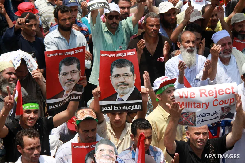 Supporters of ousted Egyptian President Mohamed Morsi take part in a protest outside Rabaa al-Adawiya mosque, after Friday prayers in Cairo, Egypt, 12 July 2013. Backers and opponents of Morsi were to hold rival rallies...