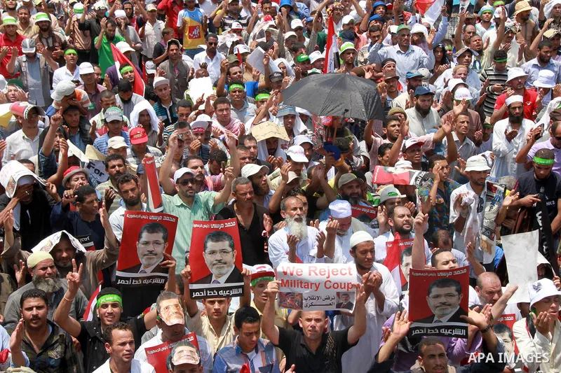 Supporters of ousted Egyptian President Mohamed Morsi take part in a protest outside Rabaa al-Adawiya mosque, after Friday prayers in Cairo, Egypt, 12 July 2013. Backers and opponents of Morsi were to hold rival rallies...