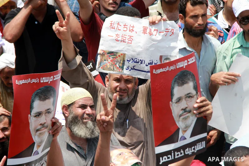 Supporters of ousted Egyptian President Mohamed Morsi take part in a protest outside Rabaa al-Adawiya mosque, after Friday prayers in Cairo, Egypt, 12 July 2013. Backers and opponents of Morsi were to hold rival rallies...