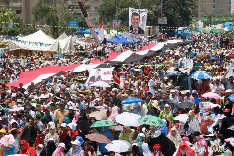 Supporters of ousted Egyptian President Mohamed Morsi take part in a protest outside Rabaa al-Adawiya mosque, after Friday prayers in Cairo, Egypt, 12 July 2013. Backers and opponents of Morsi were to hold rival rallies...