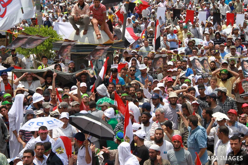 Supporters of ousted Egyptian President Mohamed Morsi take part in a protest outside Rabaa al-Adawiya mosque, after Friday prayers in Cairo, Egypt, 12 July 2013. Backers and opponents of Morsi were to hold rival rallies...