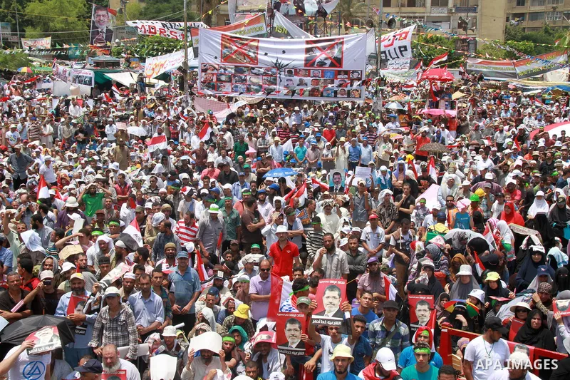 Supporters of ousted Egyptian President Mohamed Morsi take part in a protest outside Rabaa al-Adawiya mosque, after Friday prayers in Cairo, Egypt, 12 July 2013. Backers and opponents of Morsi were to hold rival rallies...
