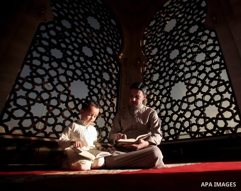A Palestinian man reads from the Koran in a mosque during the holy month of Ramadan in Gaza City, Gaza Strip, 12 July 2013. Muslims around the world are observing the holy fasting month of Ramadan in which they refrain f...