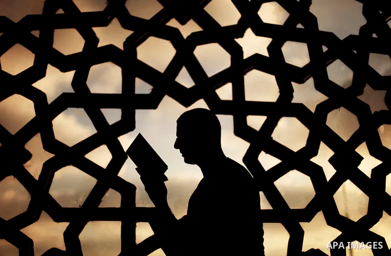A Palestinian man reads from the Koran in a mosque during the holy month of Ramadan in Gaza City, Gaza Strip, 12 July 2013. Muslims around the world are observing the holy fasting month of Ramadan in which they refrain f...